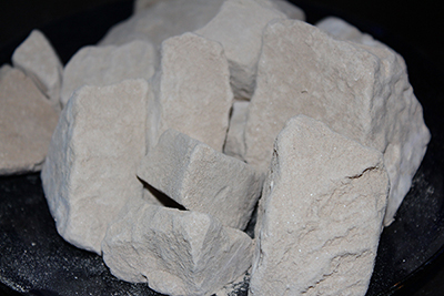 Caliche clay chalk chunks. Caliche is a desert clay dirt that is hard when dry, and a powdery chalk