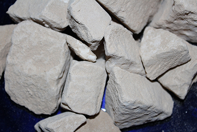Caliche clay chalk chunks. Caliche is a desert clay dirt that is hard when dry, and a powdery chalk