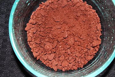 This edible reddish brown clay in mined from a mountain wall.