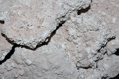 Crumbly white clay that has a rainy taste of kaolin mine wall washes from the rains.